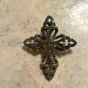 Vintage sterling marcasite cross with locking clasp.